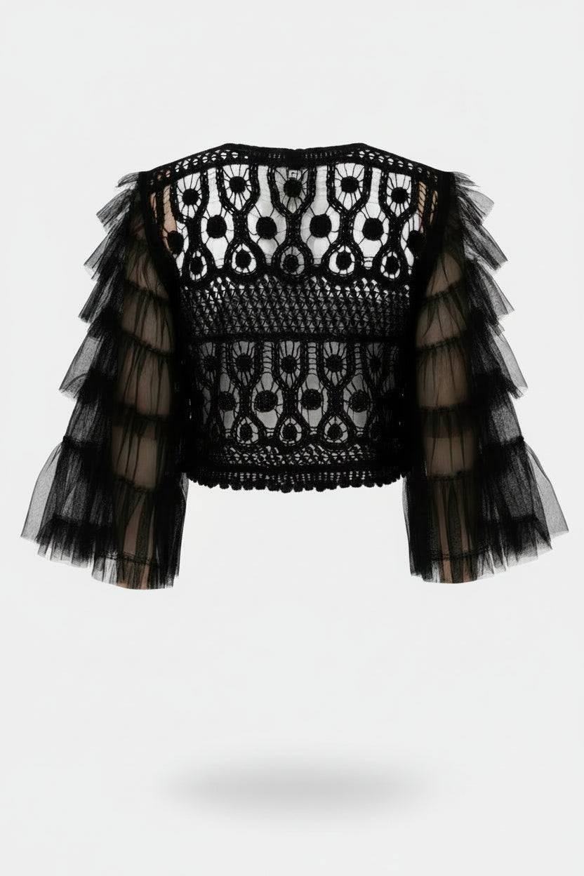 A black crochet and tulle cropped top with tiered ruffle sleeves, shown from the back on a model wearing white jeans against a light gray background.