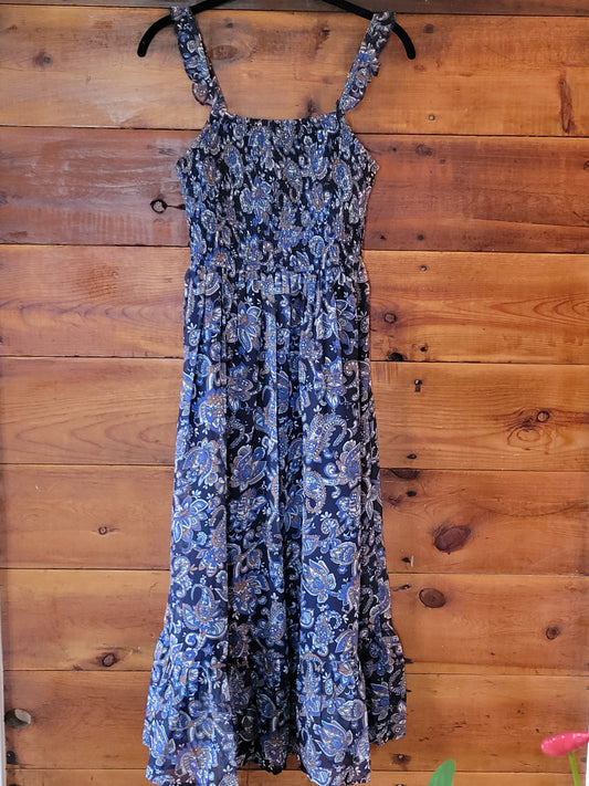 Blue floral dress on a wooden floor