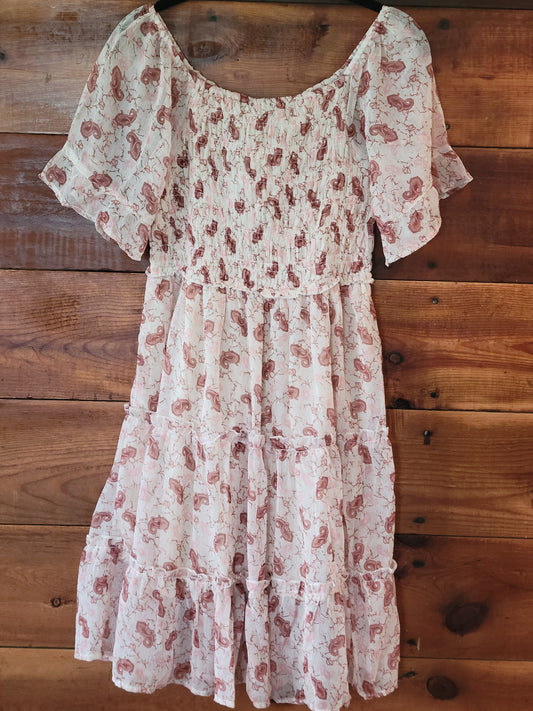Floral dress on a wooden surface