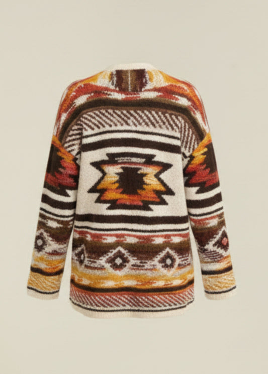 Person wearing a patterned sweater with a neutral background