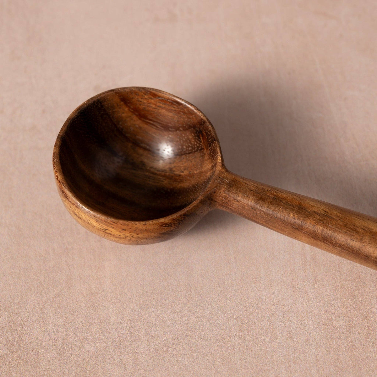 Close-up of the Subah Wood Coffee Scoop’s deep bowl showing the smooth finish and dark wood grain⠋