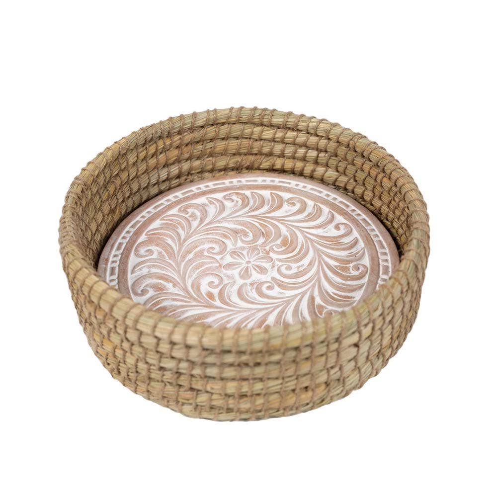 Toasty Round Bread Basket with a whitewashed floral-patterned terracotta warming insert inside a woven kaisa grass basket