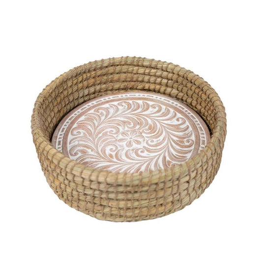 Toasty Round Bread Basket with a whitewashed floral-patterned terracotta warming insert inside a woven kaisa grass basket