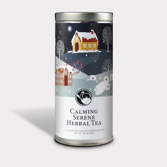 Calming Serene Herbal Tea gift tin with a snowy holiday village design and 12 tea sachets