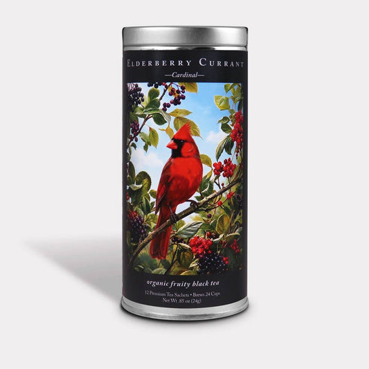 Cardinal Elderberry Currant Black Tea tin featuring a red cardinal perched among leafy branches and berries