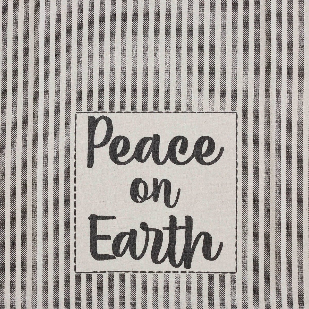 Close-up of Peace on Earth lettering framed by gray ticking stripes on a cream Christmas tea towel.
