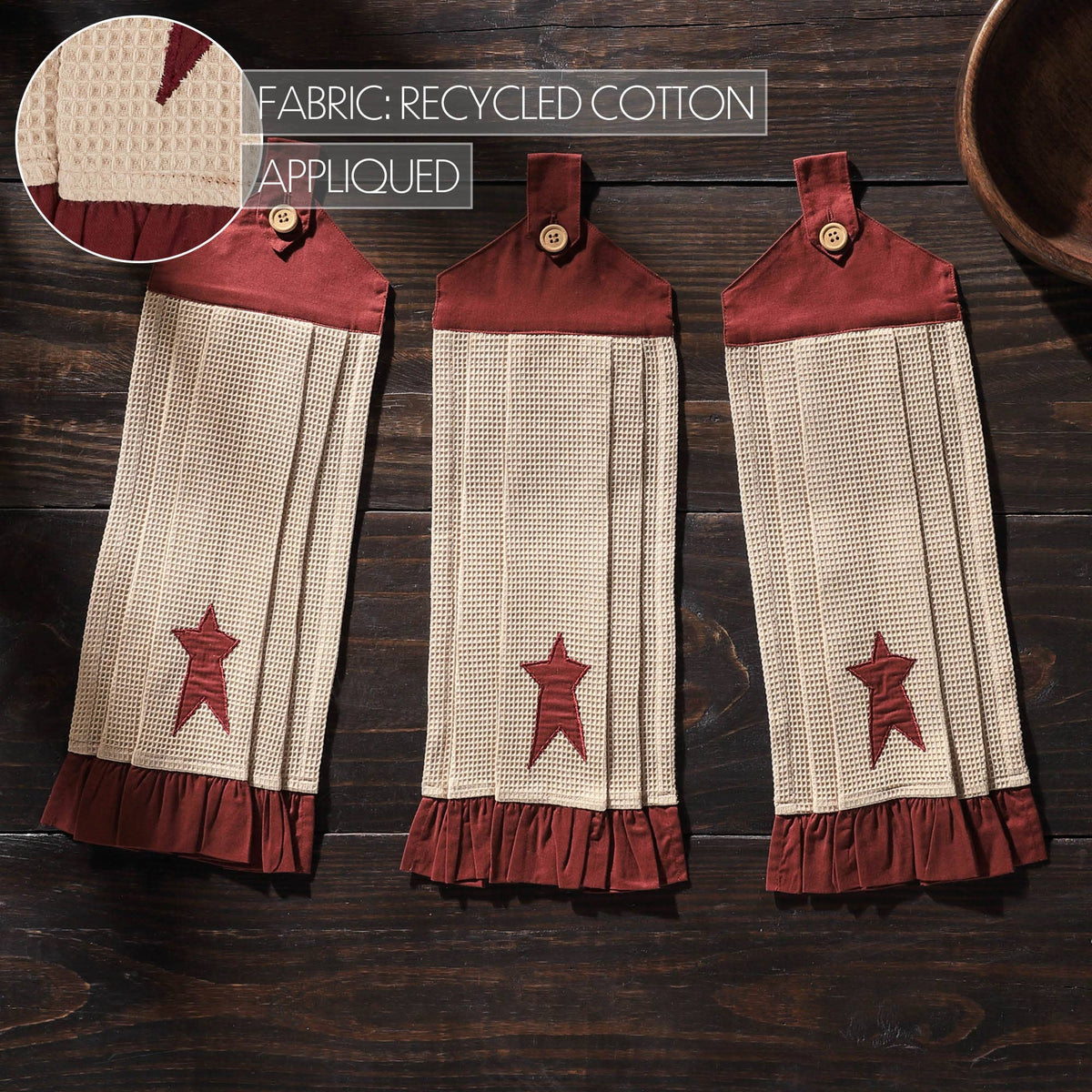 Connell burgundy star kitchen towels with an inset close-up of the waffle texture, star detail, and ruffled trim.