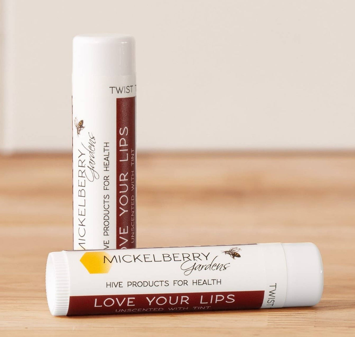 Two Mickelberry Gardens Love Your Lips Tinted lip balm tubes with burgundy labels