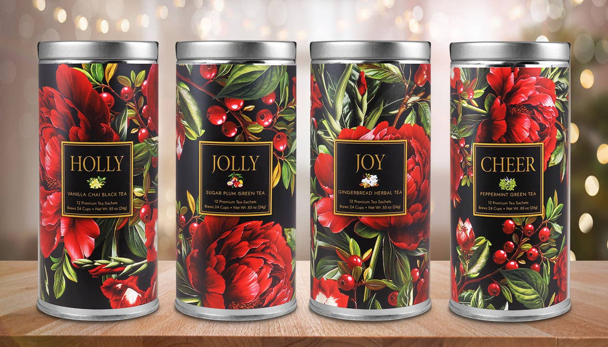 HOLLY, JOLLY, JOY, and CHEER tea gift tins with coordinating red floral and berry designs
