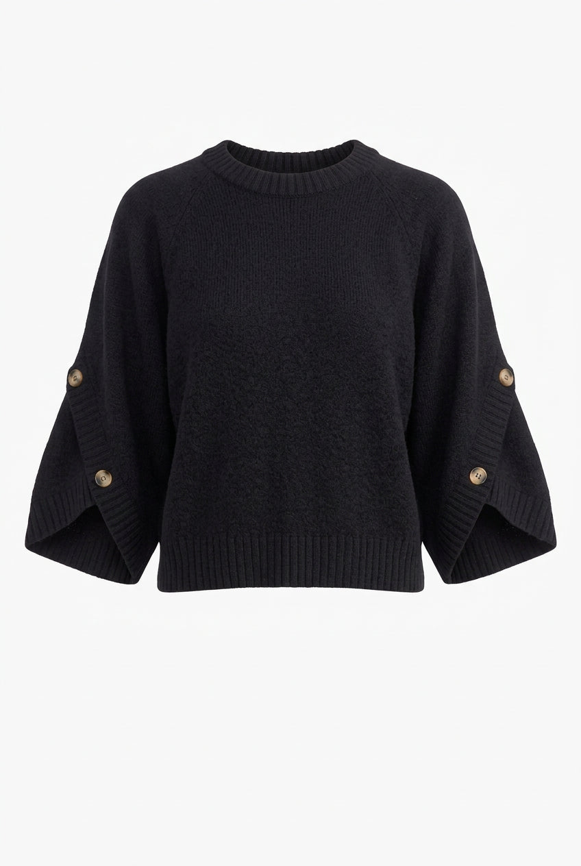 Black knit pullover with a round neckline, wide sleeves with button accents, and a ribbed hem, shown from the front.
