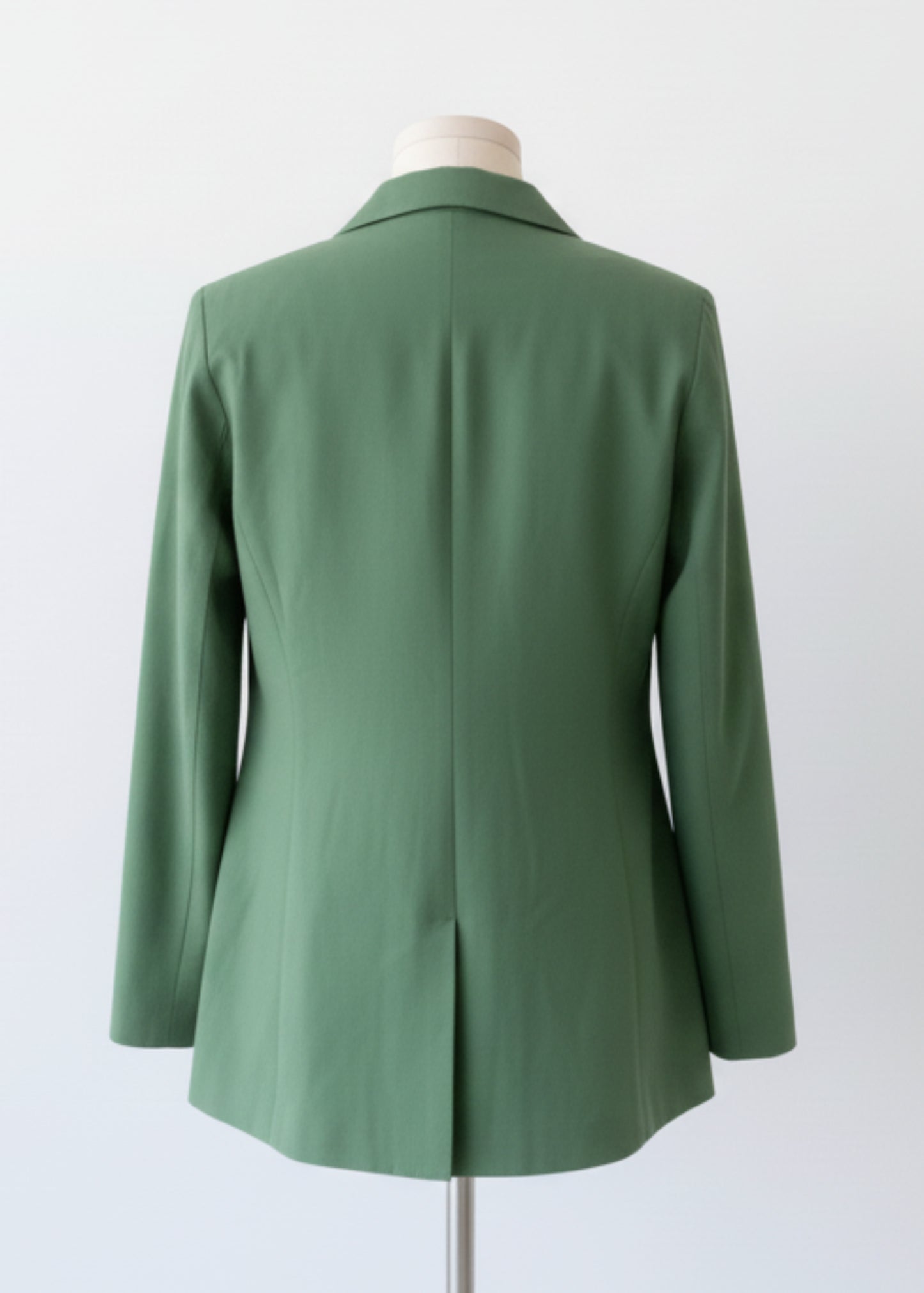  a green jacket and white background