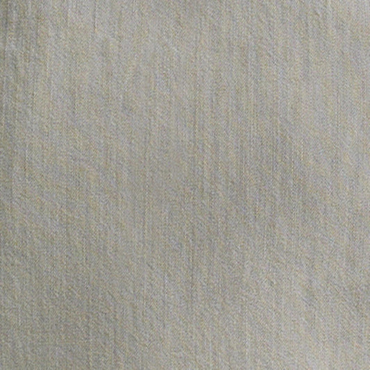 Close-up of the light grey denim fabric texture for the Wrangler women’s Western snap shirt.