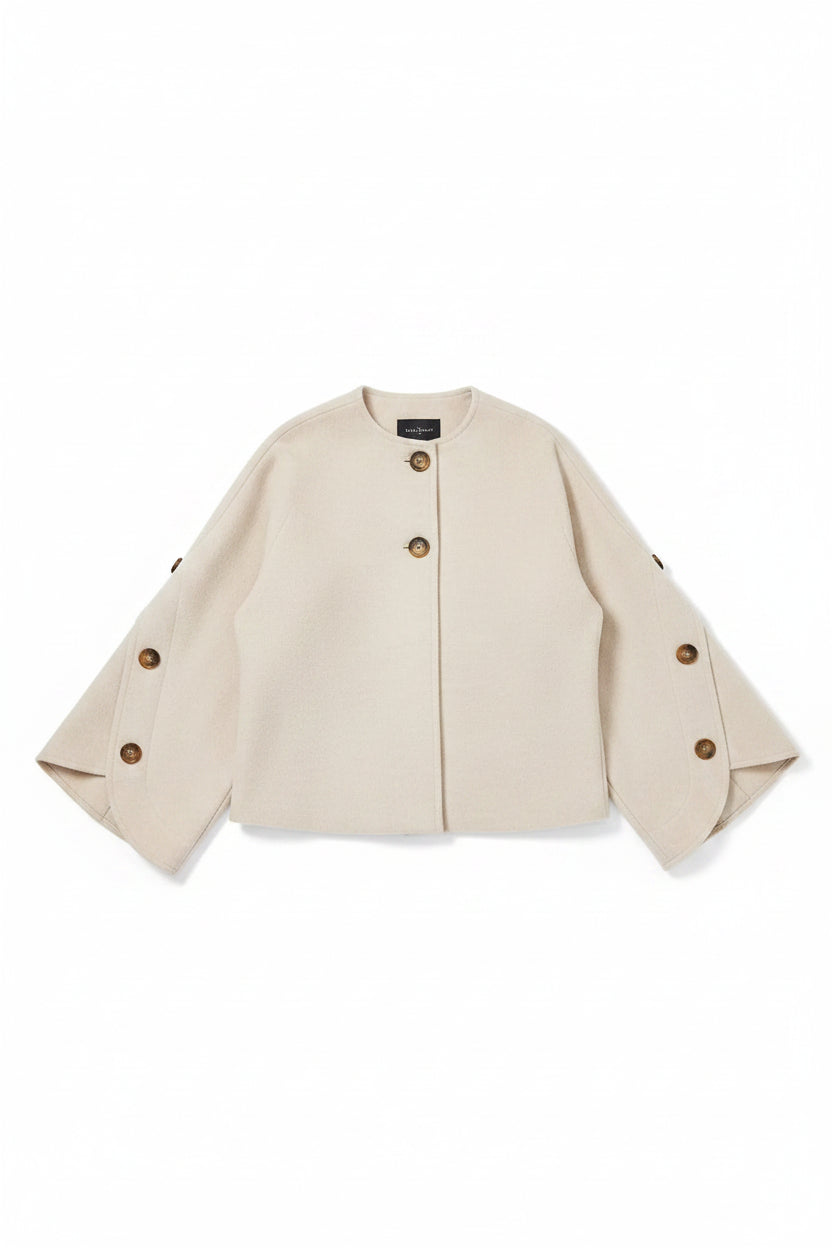 light beige cropped jacket with wide three-quarter sleeves and brown buttons