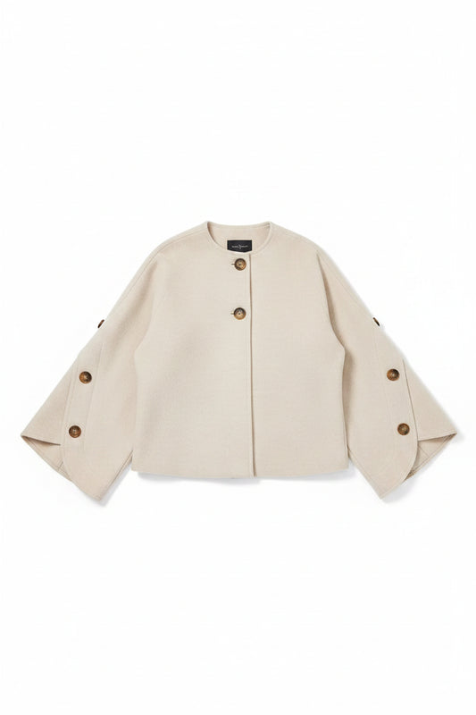 light beige cropped jacket with wide three-quarter sleeves and brown buttons