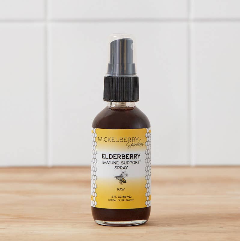 Mickelberry Gardens Elderberry Immune Support Spray 2 oz. glass mister bottle on a wooden surface