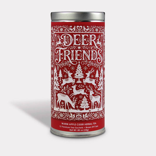 Deer Friends Apple Cider Herbal Tea in a red holiday tin with white deer, evergreen trees, and snowflakes