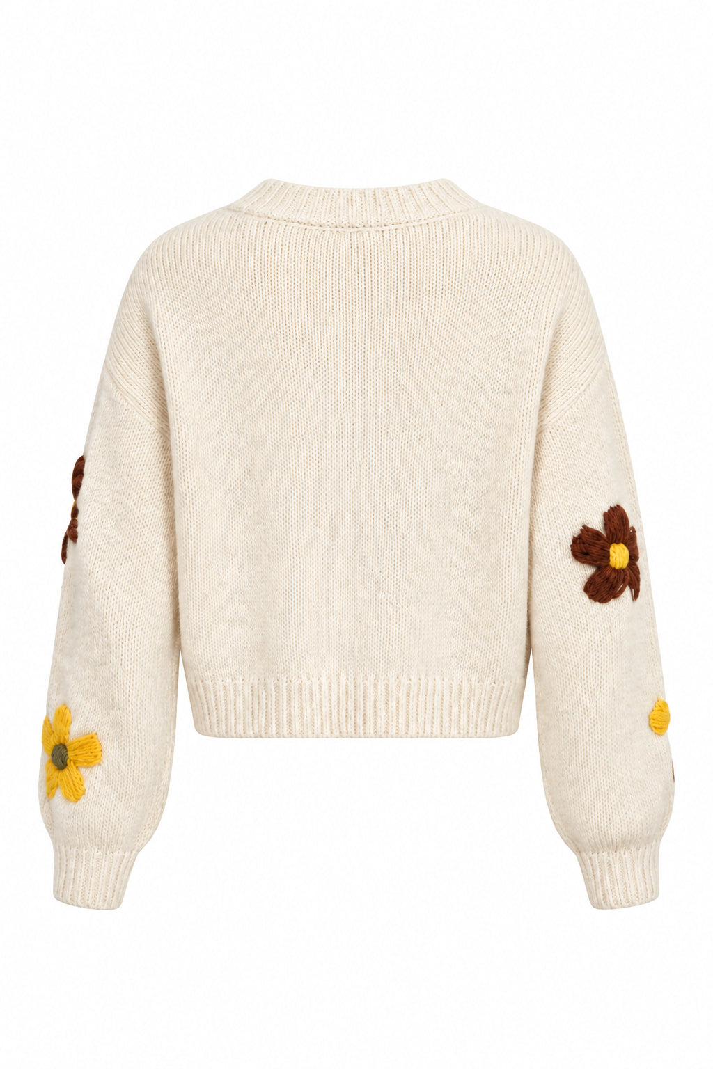 Shown from the back wearing a cream-colored knit sweater with brown and yellow flowers embroidered on the sleeves, against a plain white background.
