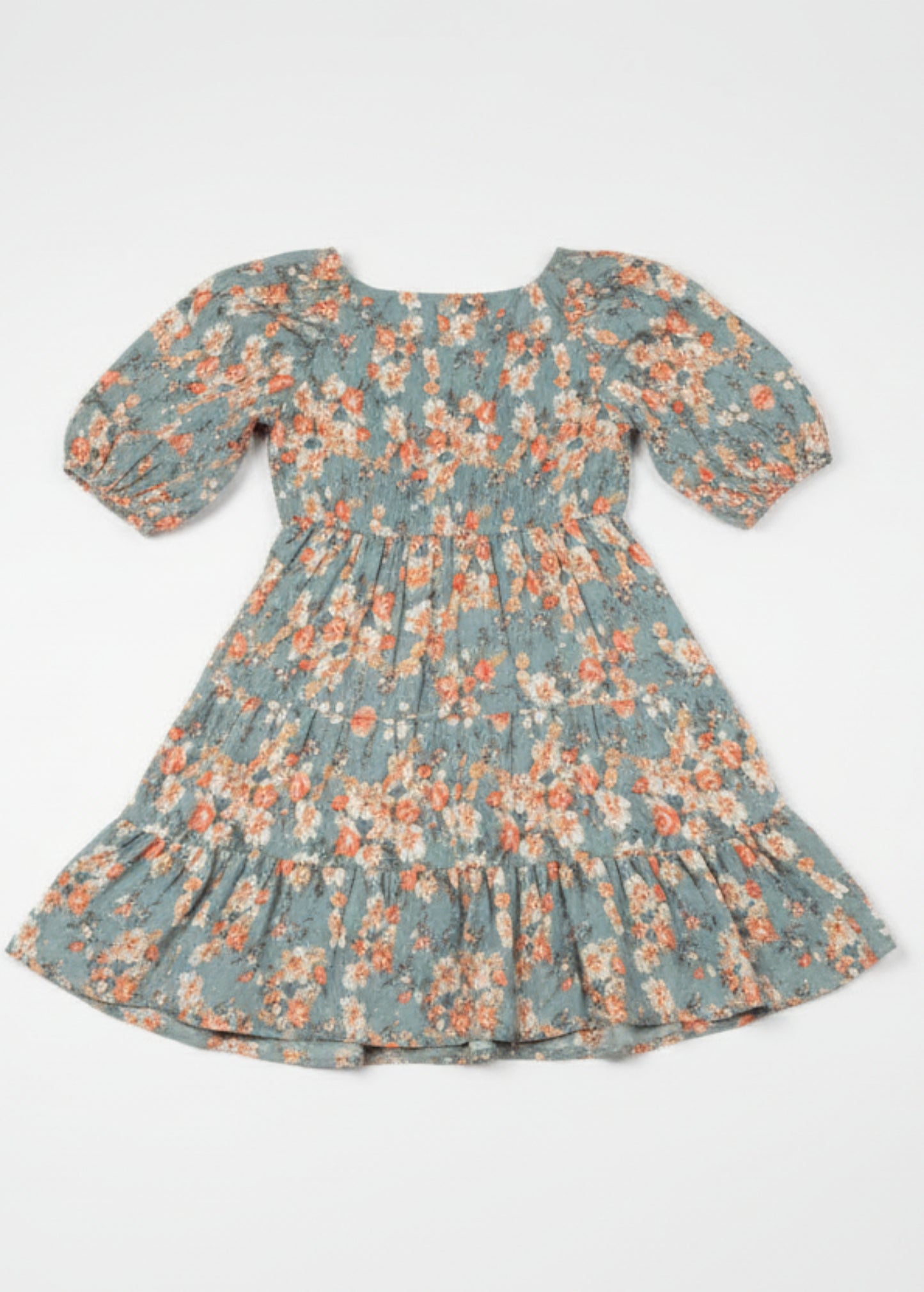 Woman wearing a floral dress on a white background