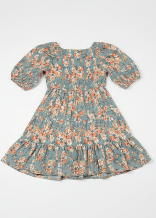 Woman wearing a floral dress on a white background