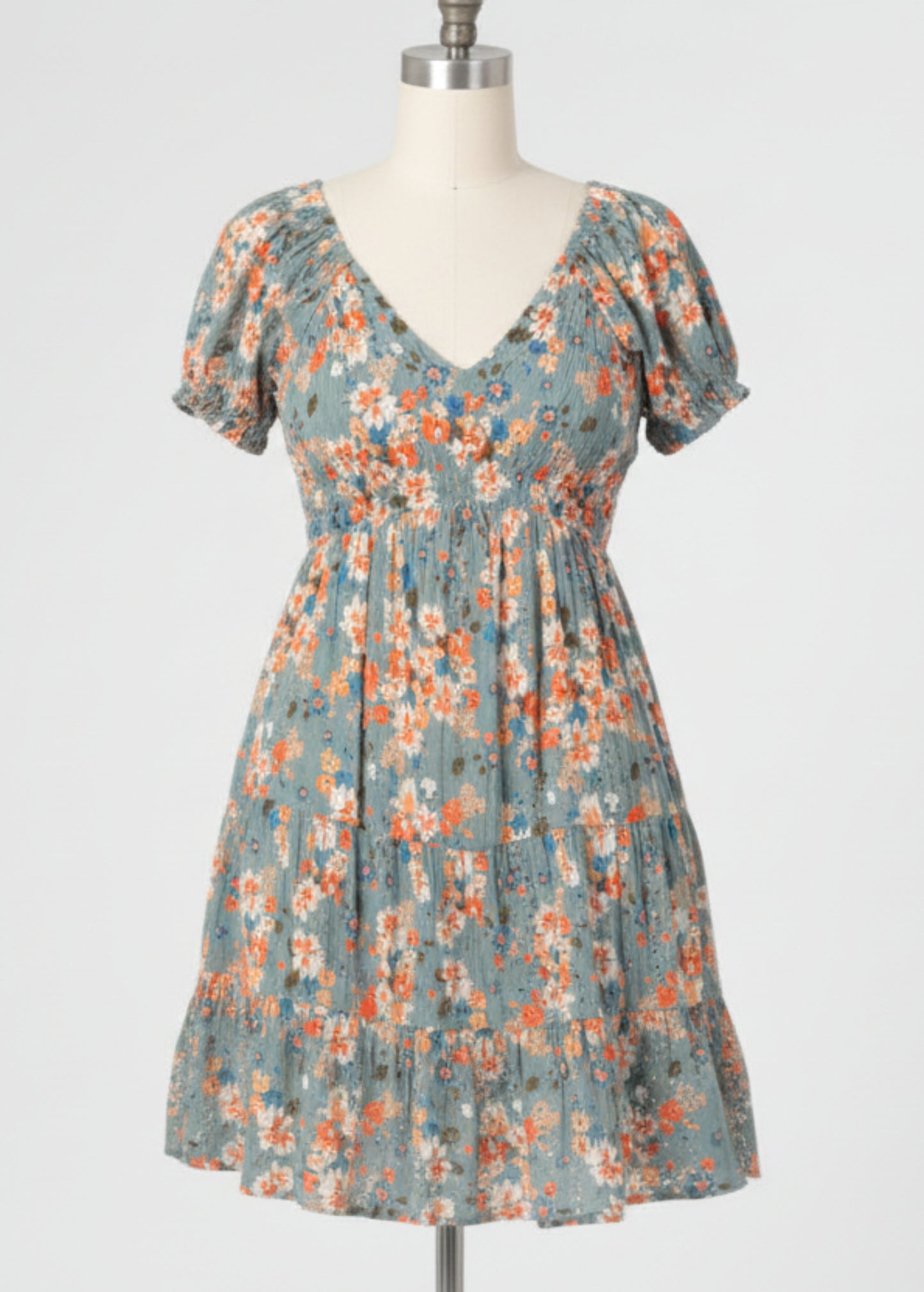Woman wearing a floral dress on a plain background