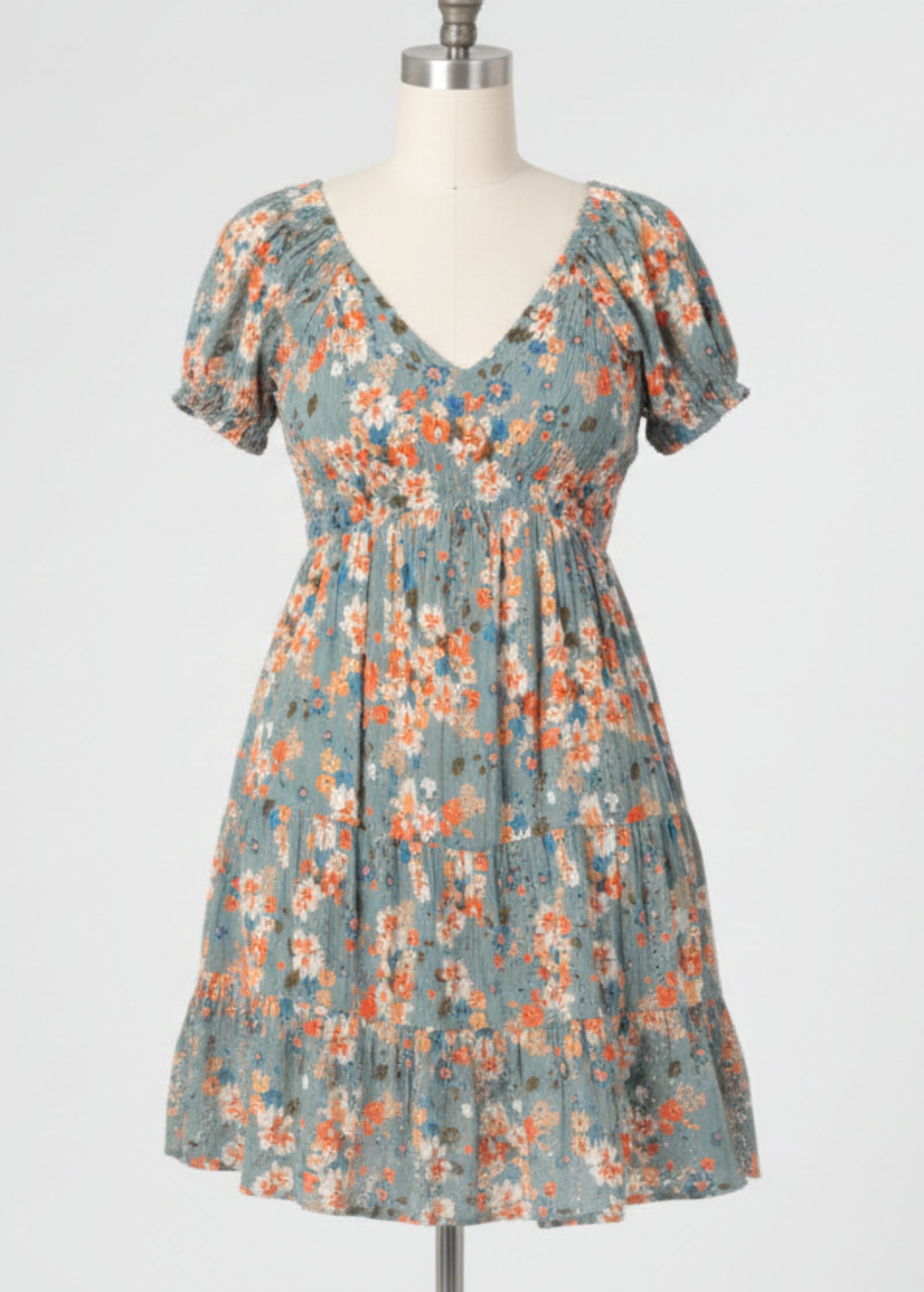 Woman wearing a floral dress on a plain background