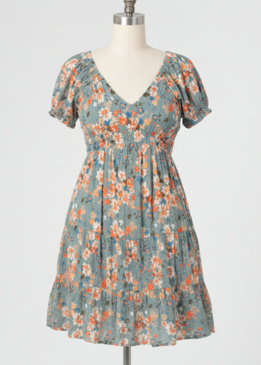 Woman wearing a floral dress on a plain background