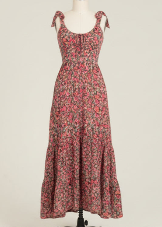 Woman wearing a floral dress on a plain background