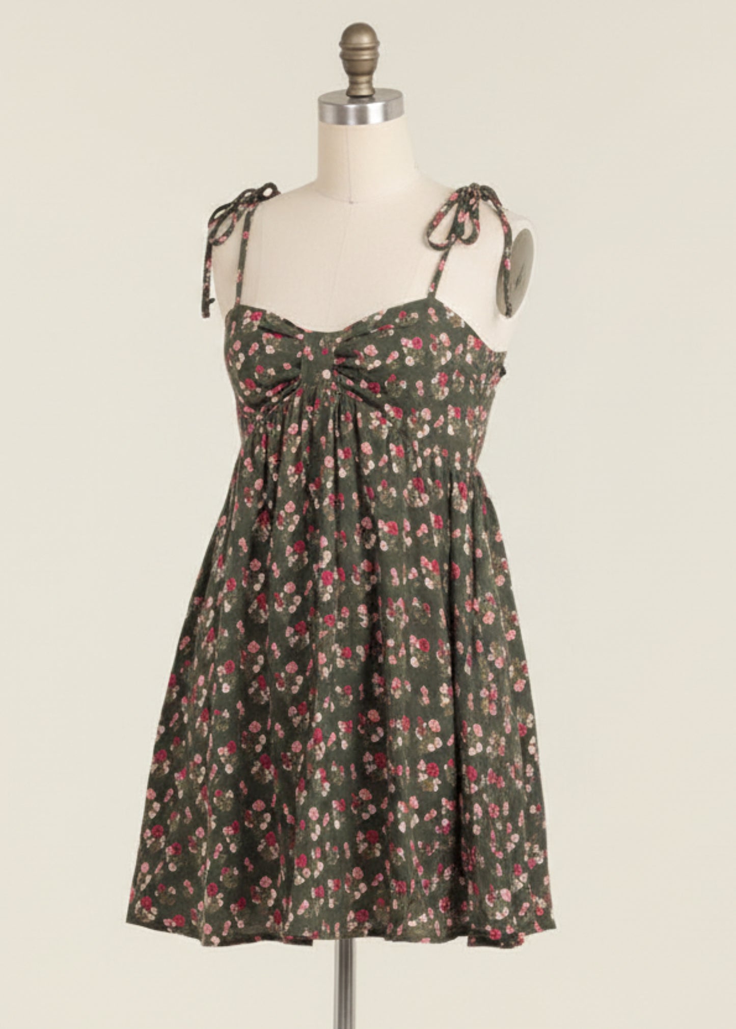 Woman wearing a floral dress on a beige background