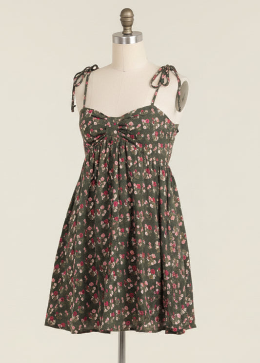 Woman wearing a floral dress on a beige background