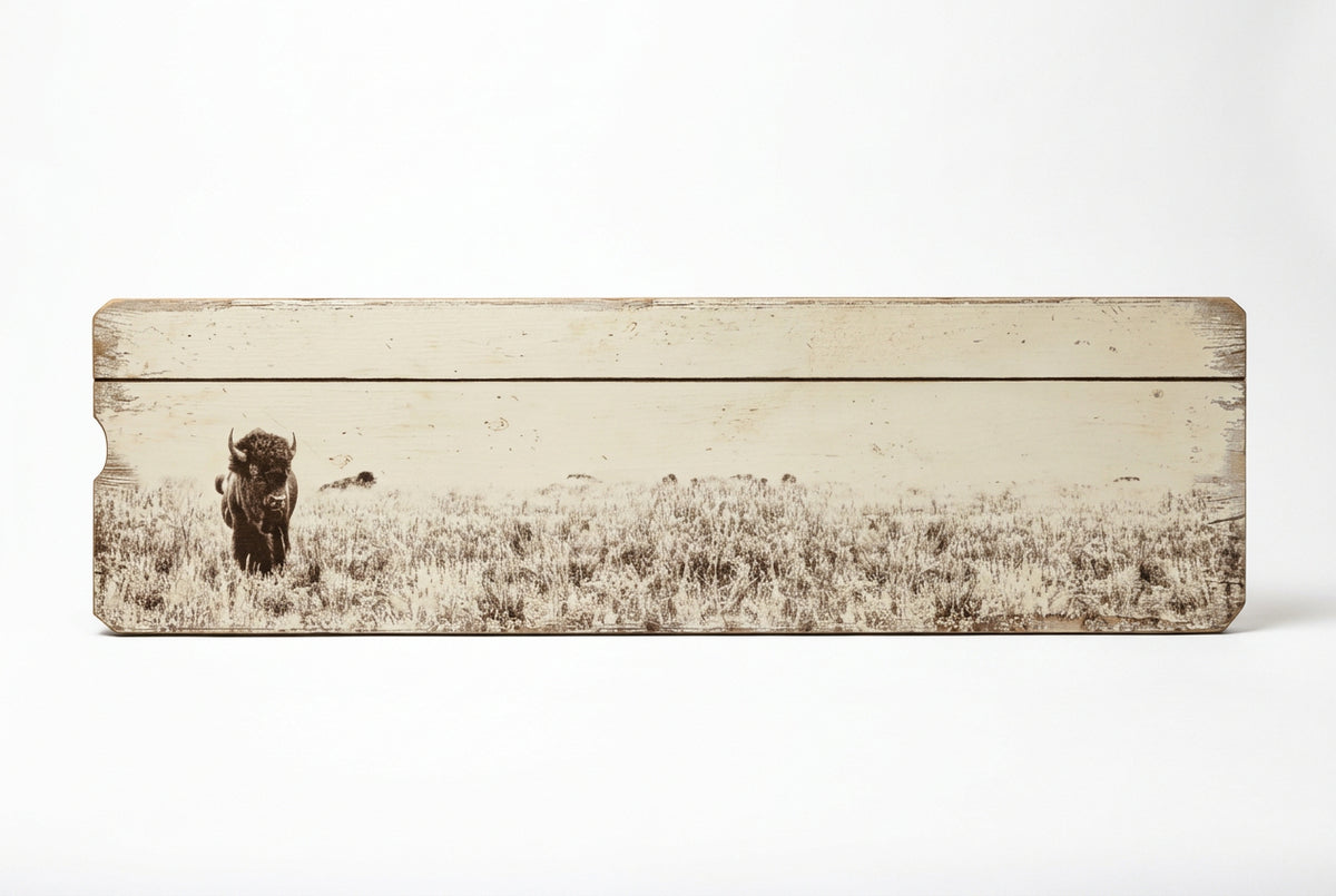 Large horizontal wooden buffalo wall art with a prairie grassland scene and distressed cream finish