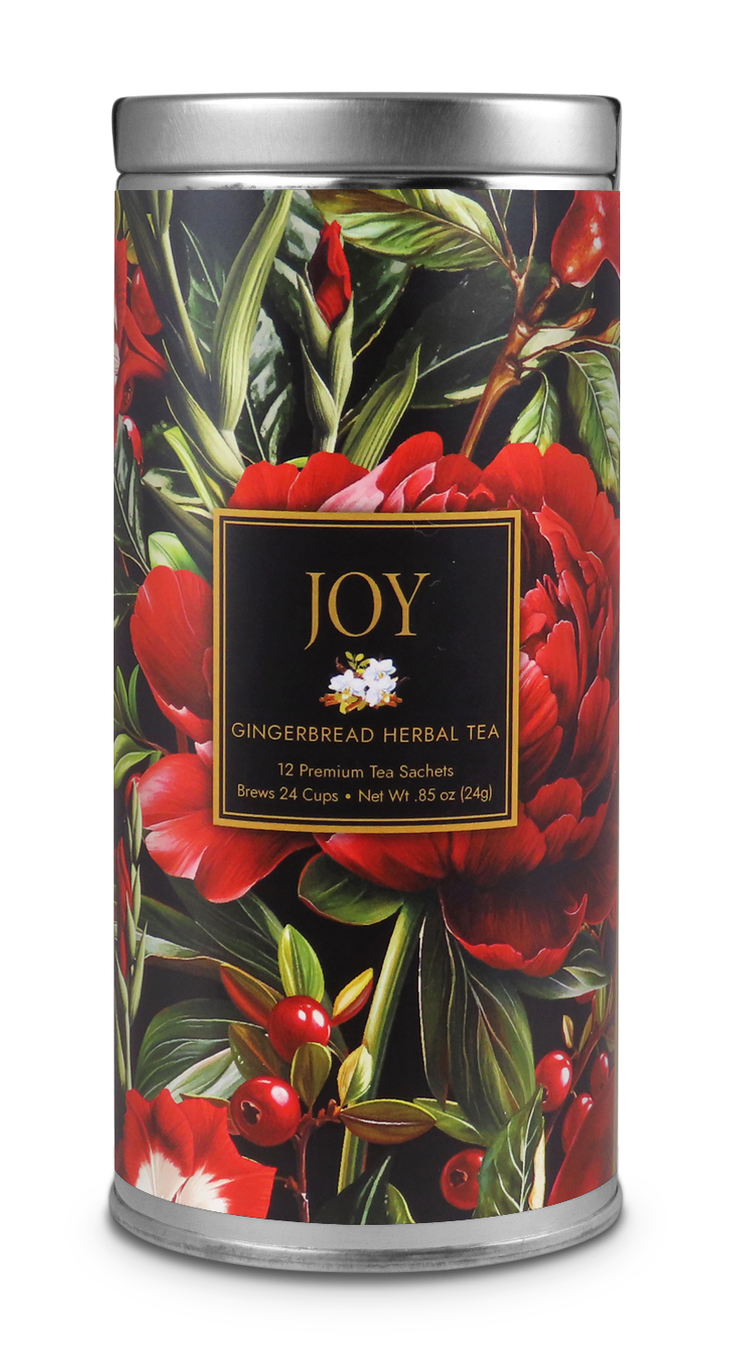 JOY Gingerbread Herbal Tea tin with red flowers, green leaves, berries, and a black-and-gold label