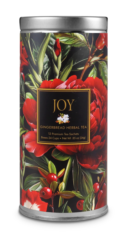 JOY Gingerbread Herbal Tea tin with red flowers, green leaves, berries, and a black-and-gold label