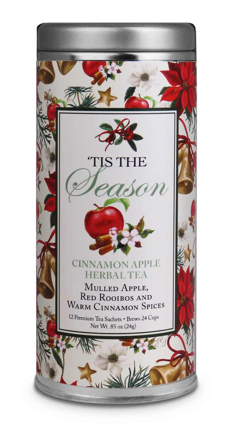 Tis the Season Cinnamon Apple Herbal Tea tin decorated with apples, poinsettias, golden bells, and evergreen sprigs