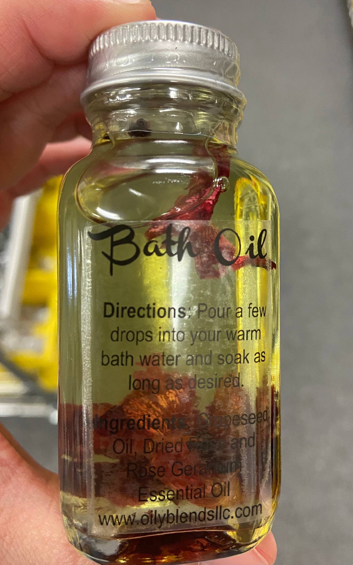 Close-up of a bath oil bottle showing its directions and ingredient label