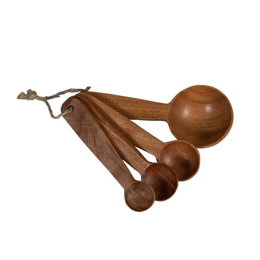 Set of four handcarved neem wood measuring spoons in graduated sizes, tied together with jute string