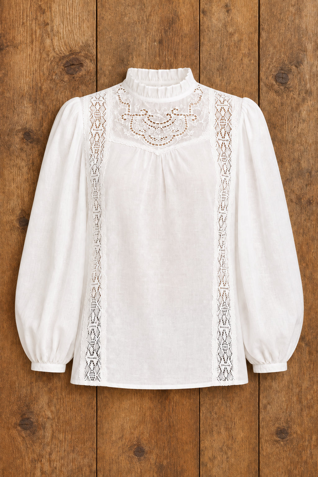 A white long-sleeve blouse with puff sleeves, lace trim, and a ruffled mock neck