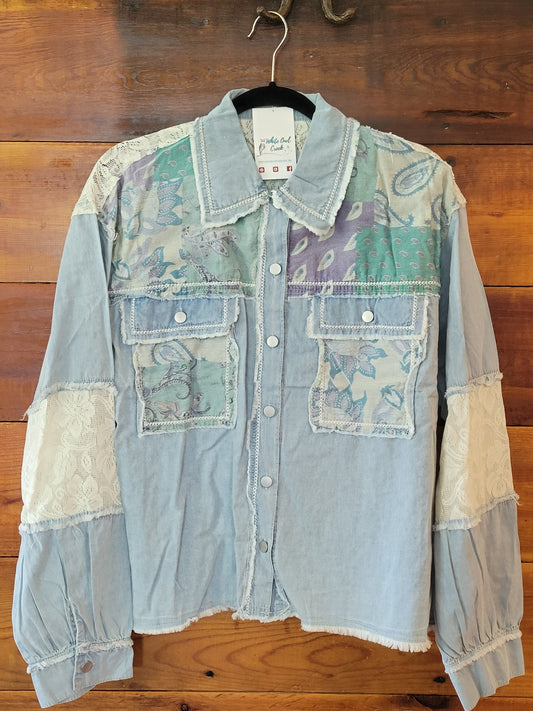 Patchwork denim jacket on a wooden floor