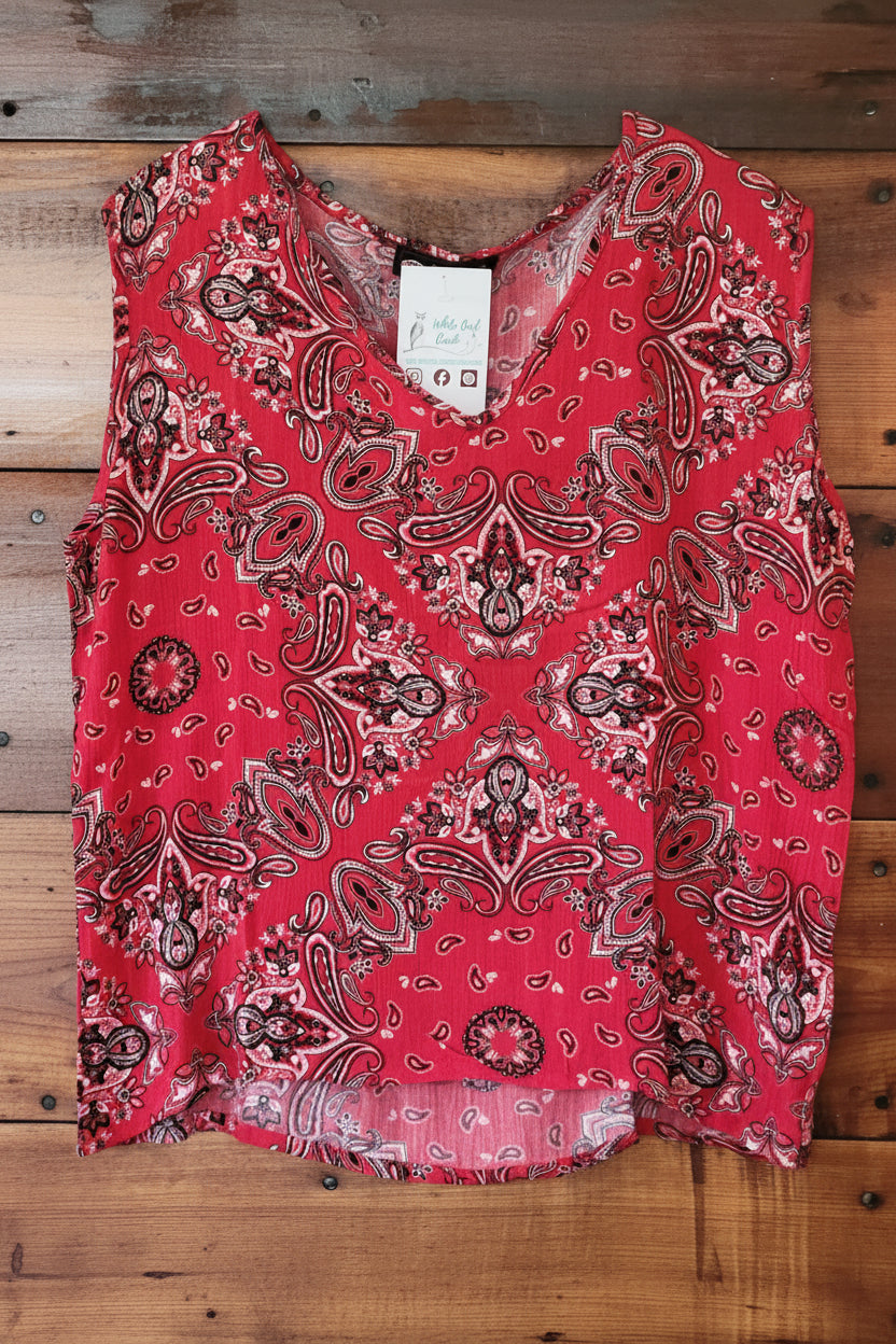 Red bandana patterned fabric on a wooden surface