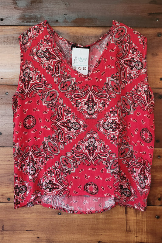 Red bandana patterned fabric on a wooden surface