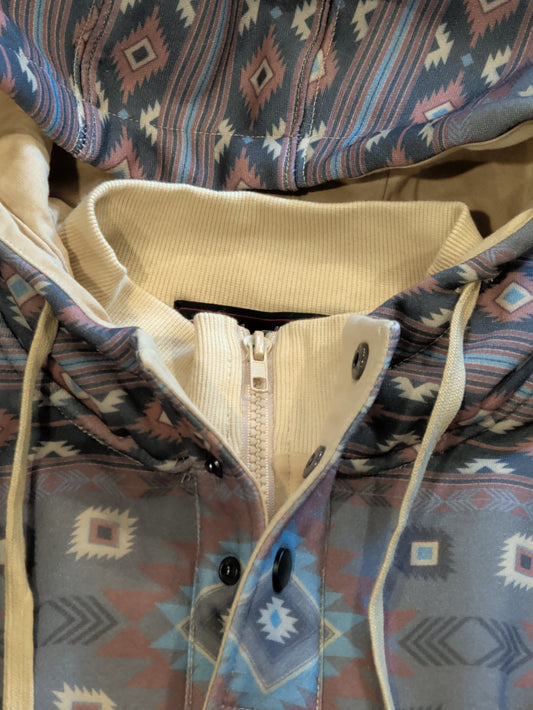 Close-up of the hoodie’s short zipper beneath an open snap-front placket and cream ribbed inner collar