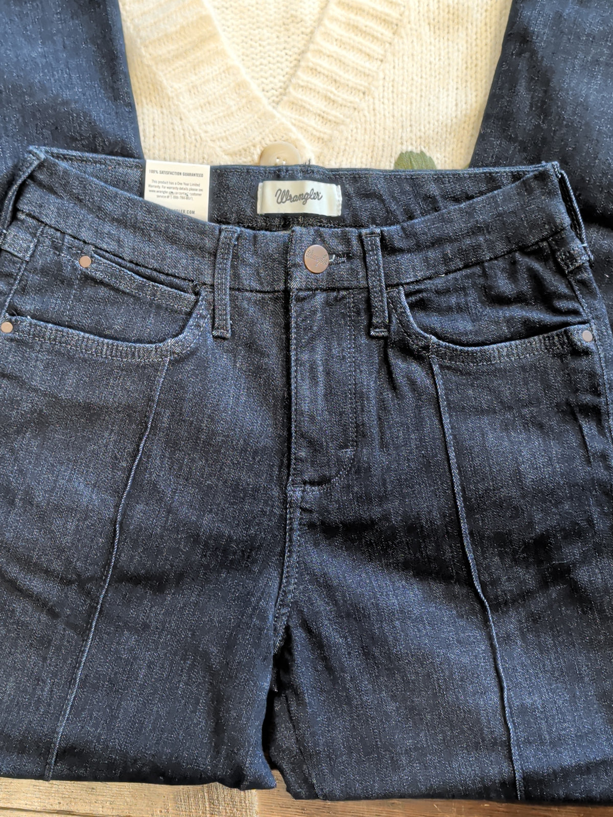 Front waistband of Wrangler Bespoke Camryn jeans showing the button, pockets, belt loops and pintuck seams.