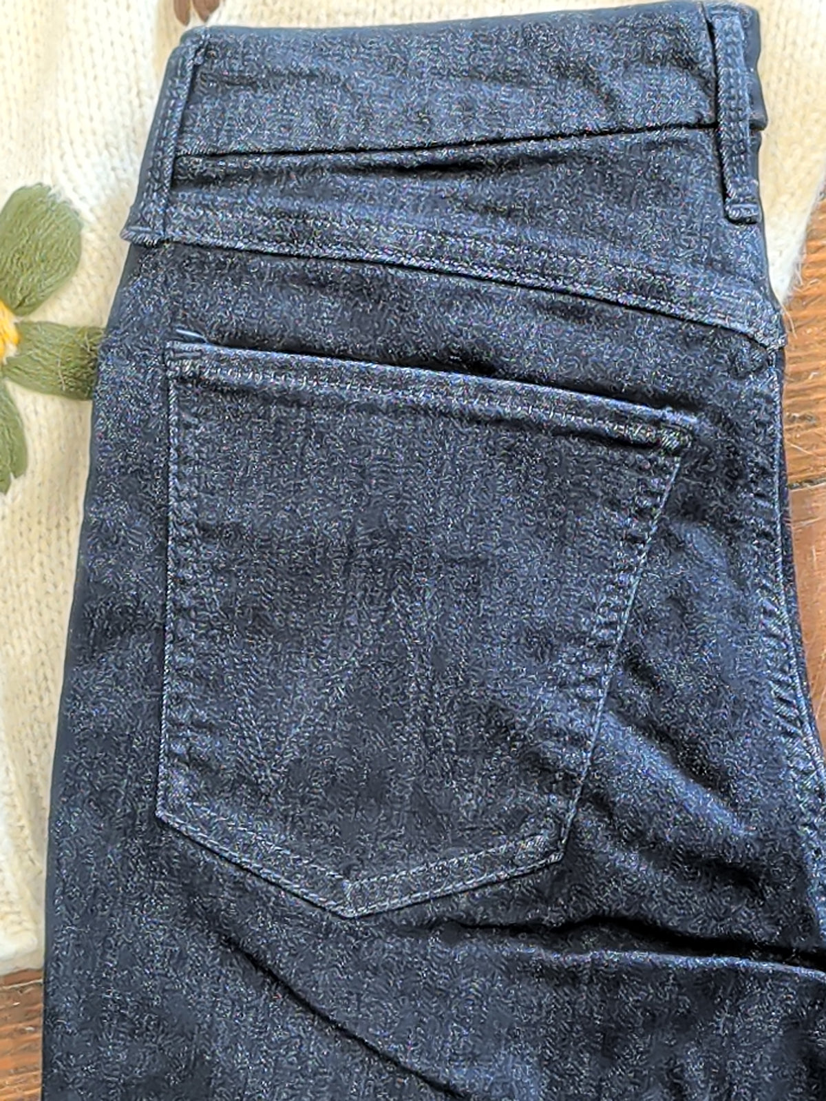 Back pocket, waistband and belt loop detail on Wrangler Bespoke Camryn dark blue jeans.