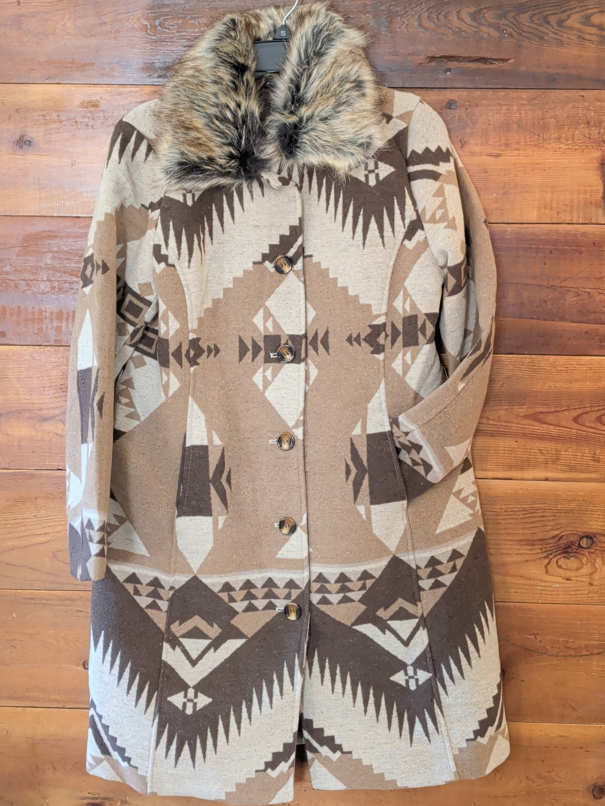 Front view of women's Southwestern print long coat with faux fur collar, long sleeves, and front pockets.