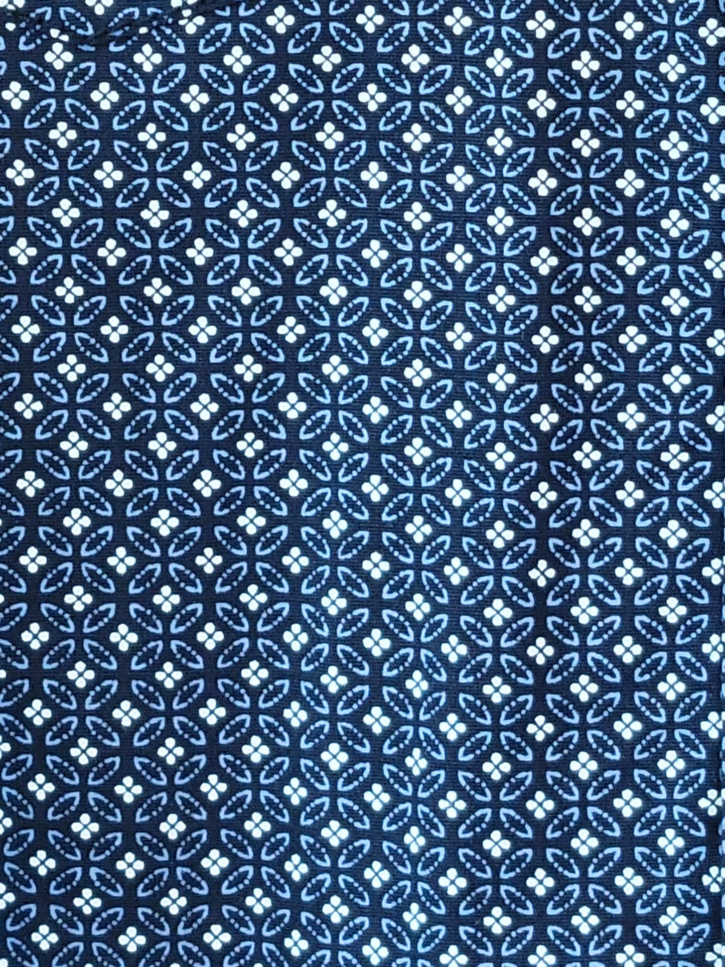 Blue and white geometric patterned fabric texture