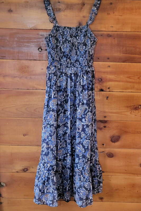 Blue floral dress on a wooden surface