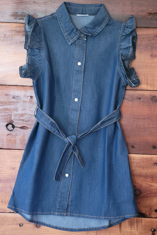 Blue denim dress on a wooden surface