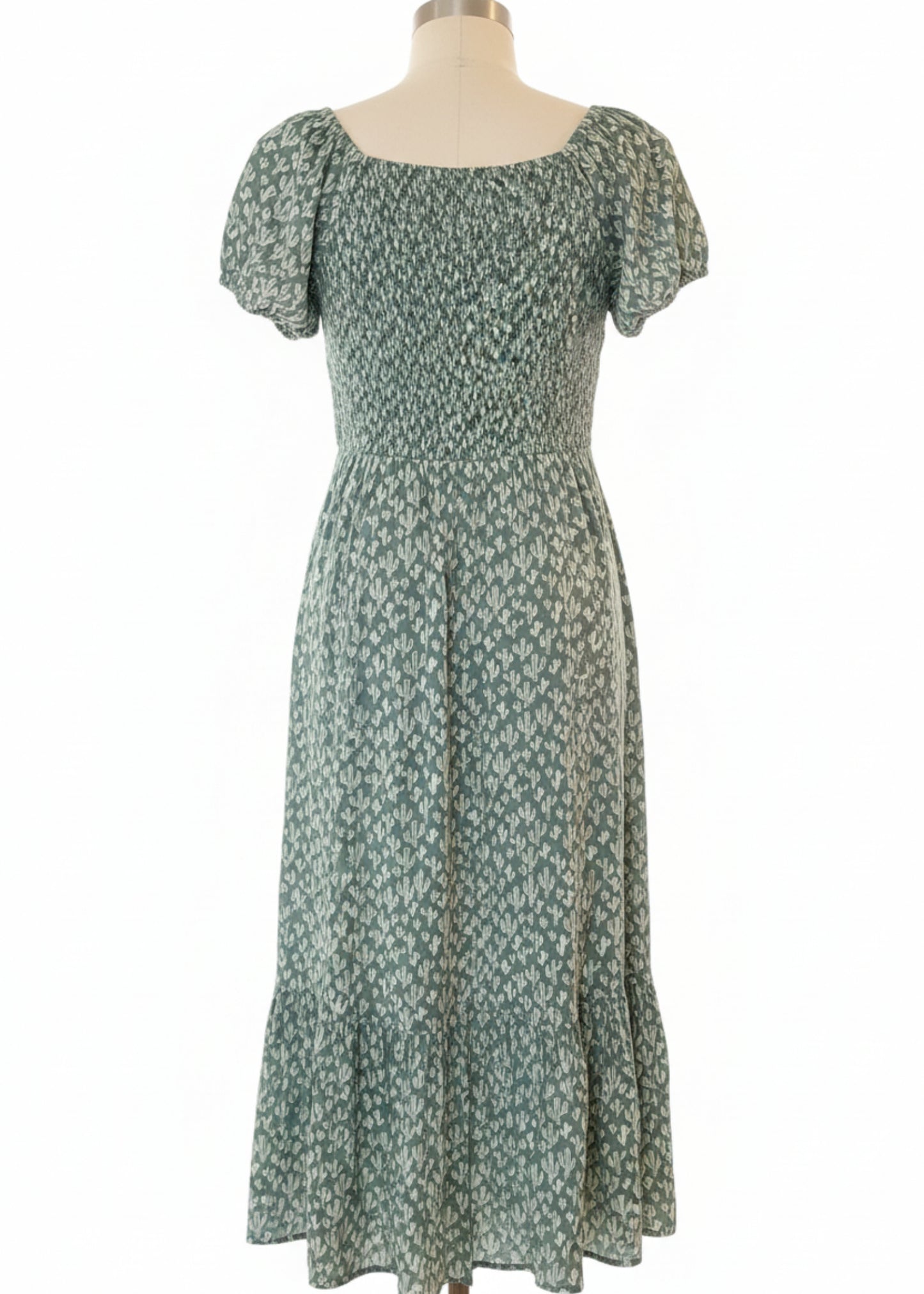 Green Cactus dress on a manniquin
