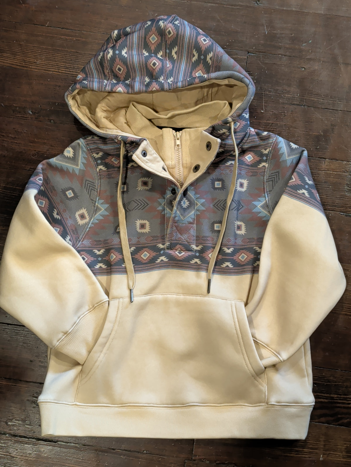 Boys cream fleece hoodie with a Southwestern print yoke and hood, zip-and-snap neckline, and kangaroo pocket