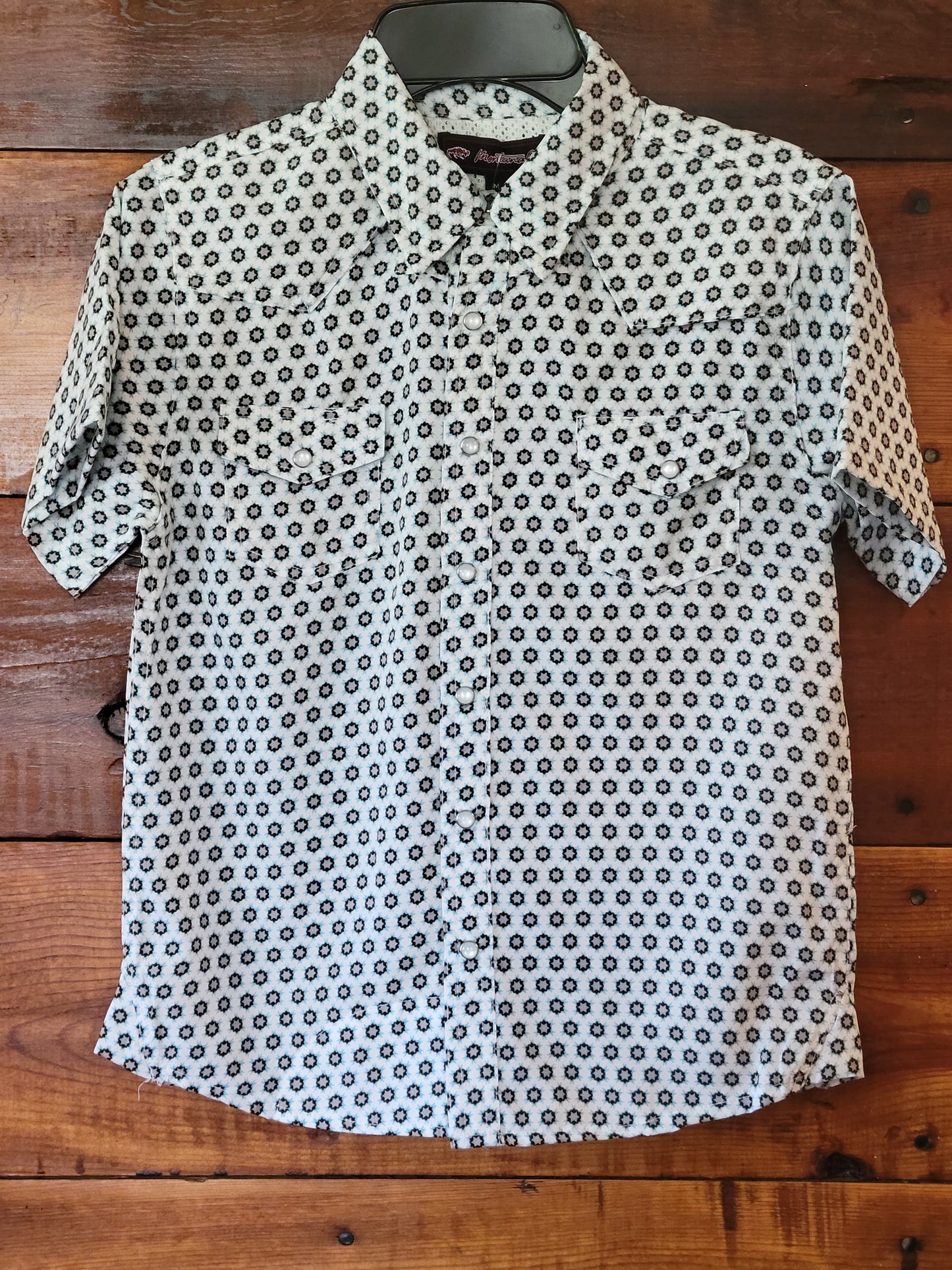 Star-patterned shirt on a wooden surface