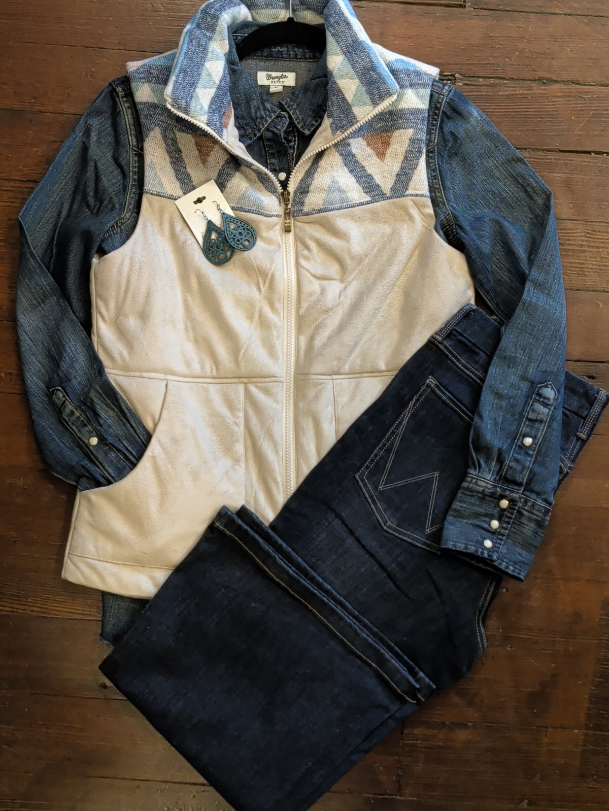 Cream Two Tone Vest styled with a denim shirt, dark jeans, and turquoise teardrop earrings.